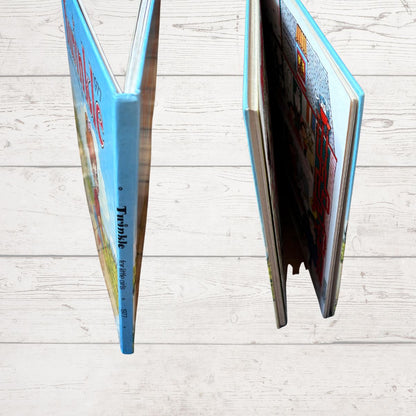 A hardcover book titled 'Twinkle'  shown standing open and closed 