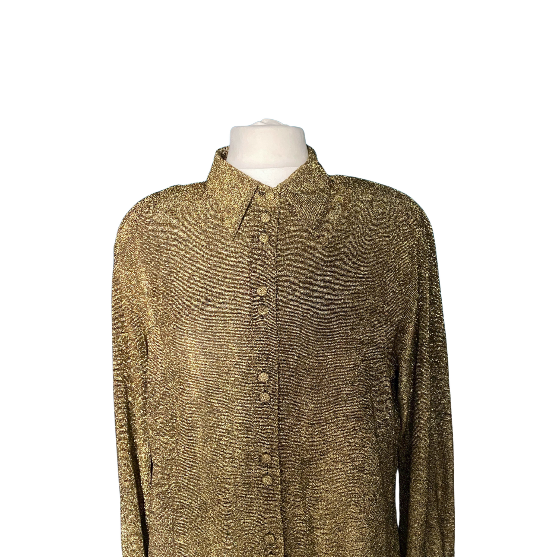 Shimmering gold blouse featuring fabric-covered buttons and a stylish dagger collar.