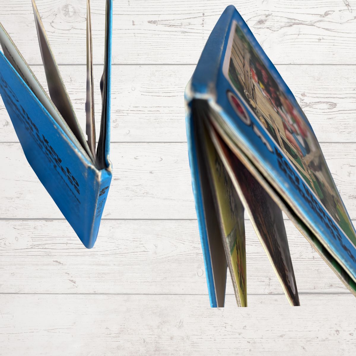 Book spine close up with colourful pages on a light wooden surface