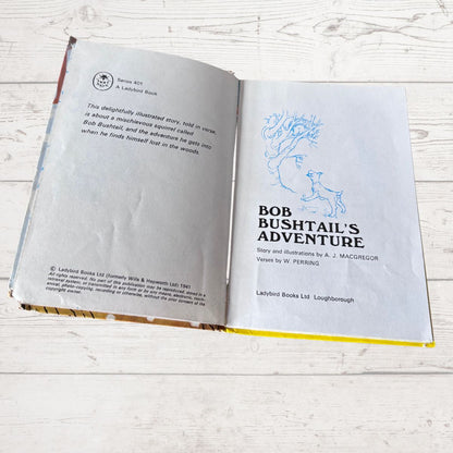 An open children's book titled 'Bob Bushtail's Adventure' by A. J.