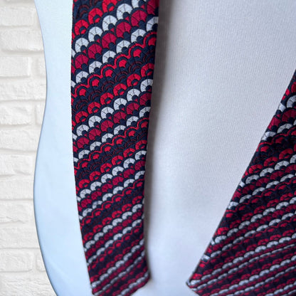 Patterned tie on a mannequin with a white background