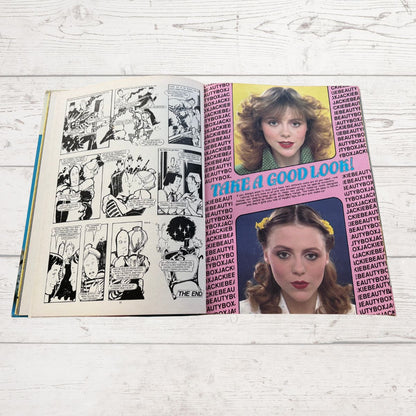 Comic book with a woman's face and text on a wooden surface