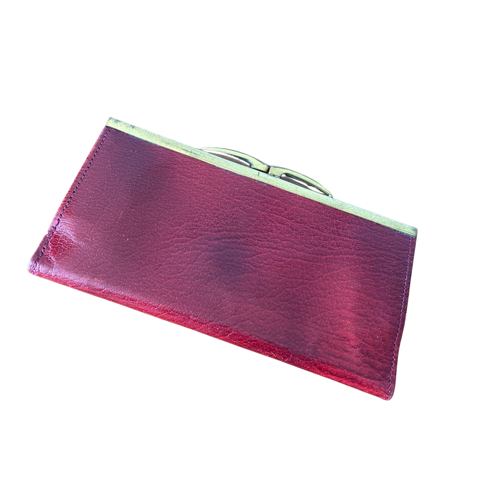 Textured dark red leather wallet with a gold tone covered popper opening and gold-tone metal frame