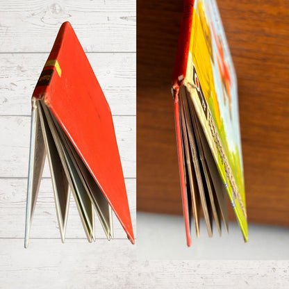 Two views of a colorful book with a red cover on a wooden surface.