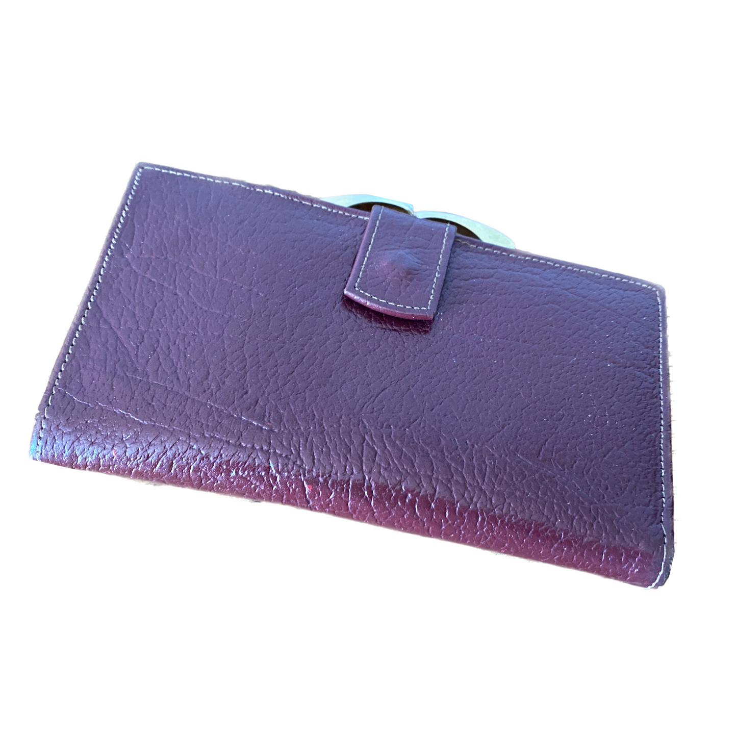 Textured wine red/brown leather wallet with a covered  popper opening and gold-tone metal frame