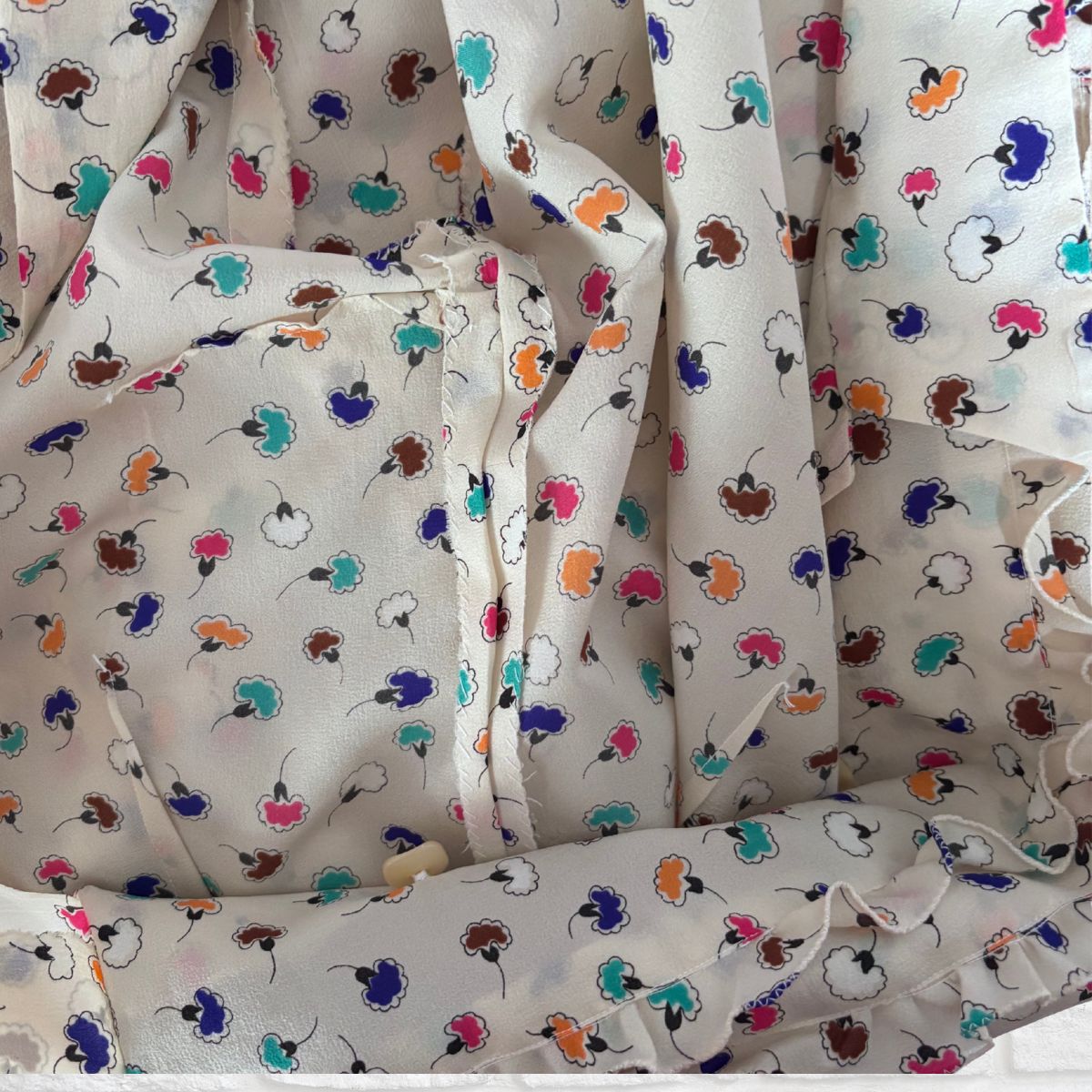 Floral patterned dress with colourful flowers on a white background