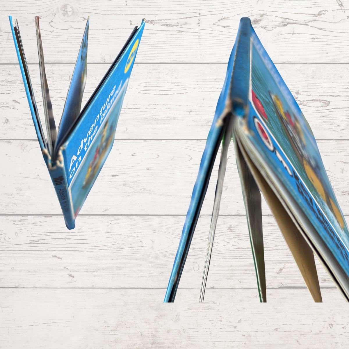 Book spine close  up with colourful pages on a light wooden surface