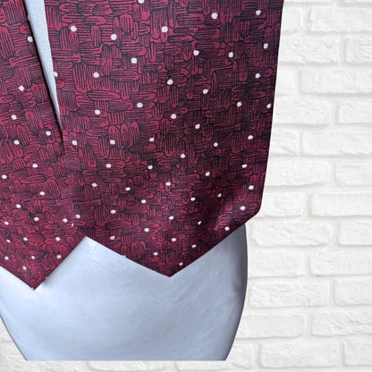 Red patterned cravat on a white background