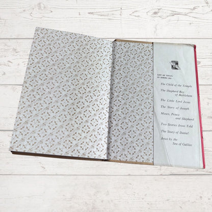 Open book with patterned pages on a wooden surface