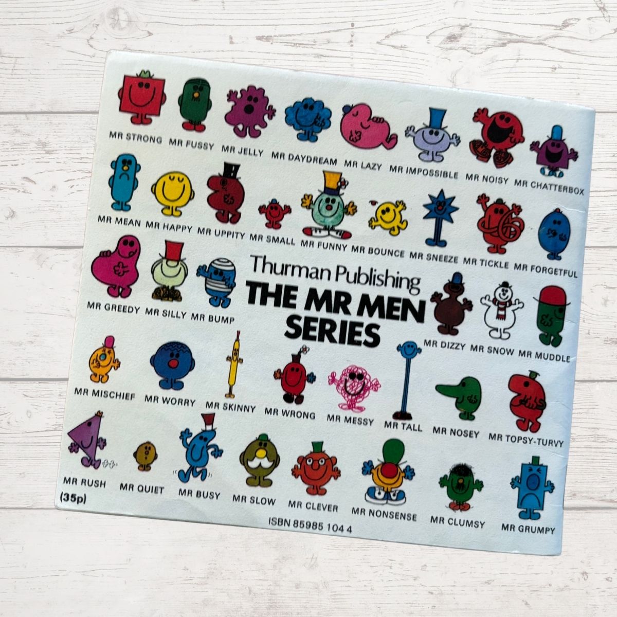 Book back cover featuring various colourful characters from the Mr Men series by Thurman Publishing on a white background.