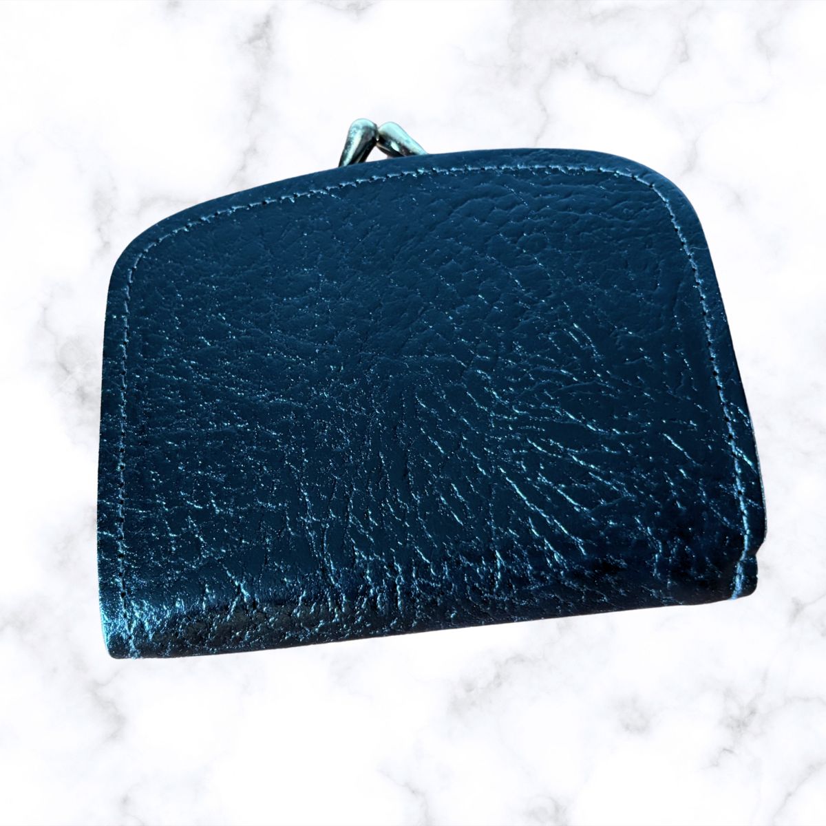 Black textured wallet on a white background