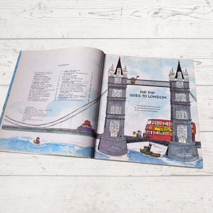 Open book with illustrations of London landmarks on a wooden surface