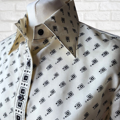 Cream and black geometric print 70s shirt on a white background 