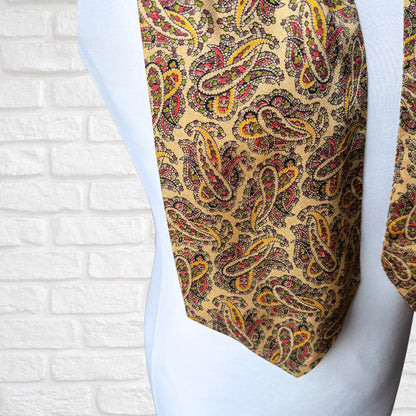 Patterned tie on a mannequin against a white brick wall background