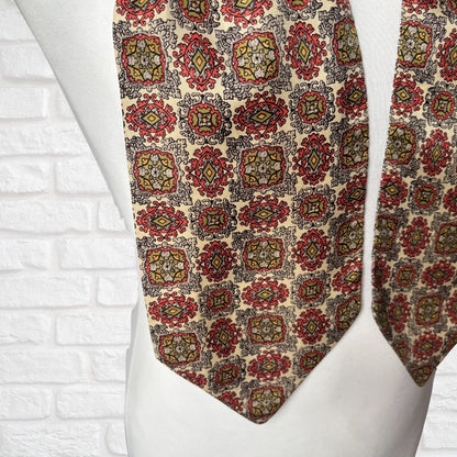 Patterned tie on a mannequin against a white brick wall background
