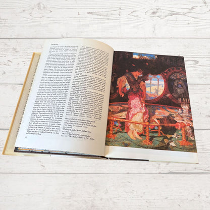 Open book with a colorful illustration on a wooden surface
