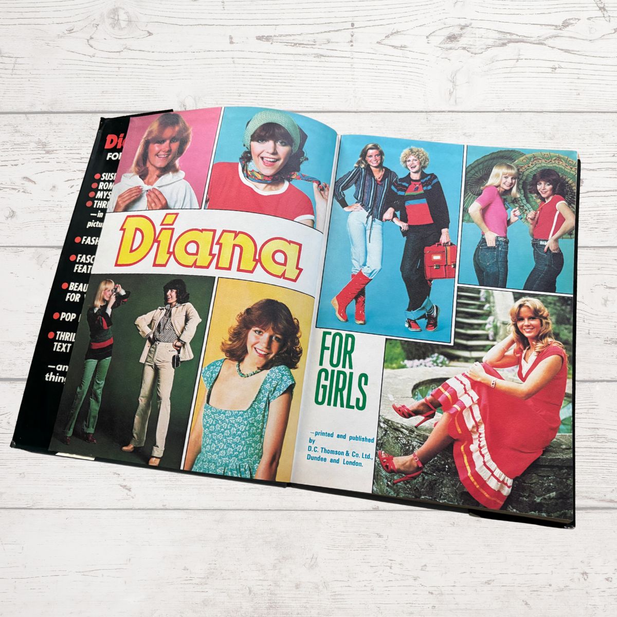 Open book with vintage fashion illustrations and 'Diana for Girls' text on a wooden surface
