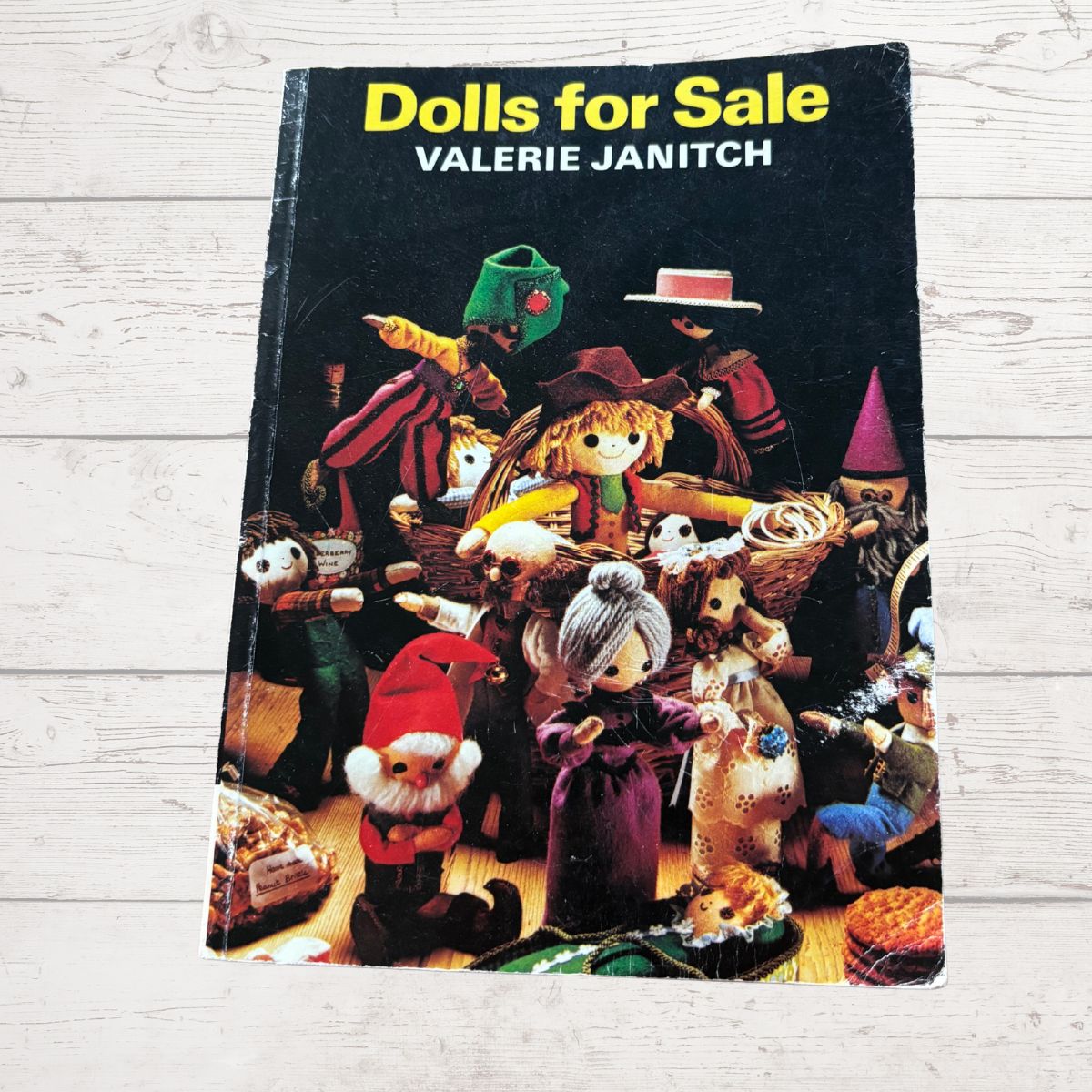 Book titled 'Dolls for Sale' by Valerie Janitch with illustrations of dolls on the cover.
