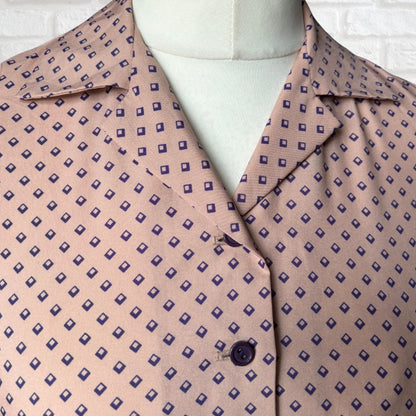 Patterned dress with purple  geometric design on a white background