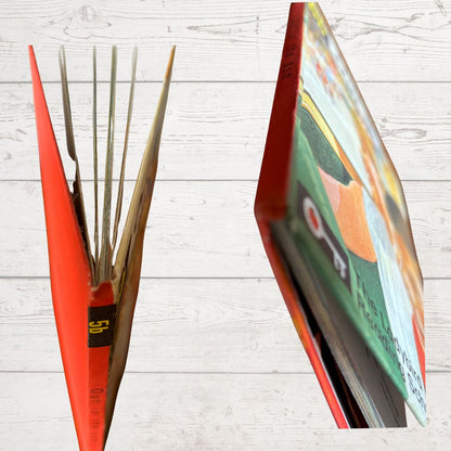 Red book spine close up on a light wooden surface