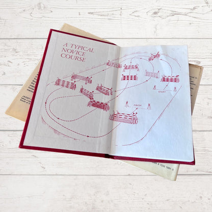 Open book showing a horse eventing course 