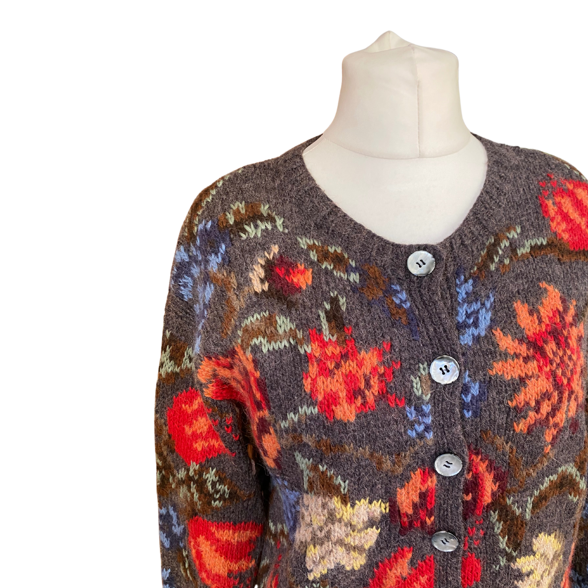 Crew neck design adds a classic touch to this chunky charcoal cardigan with eye-catching floral pattern