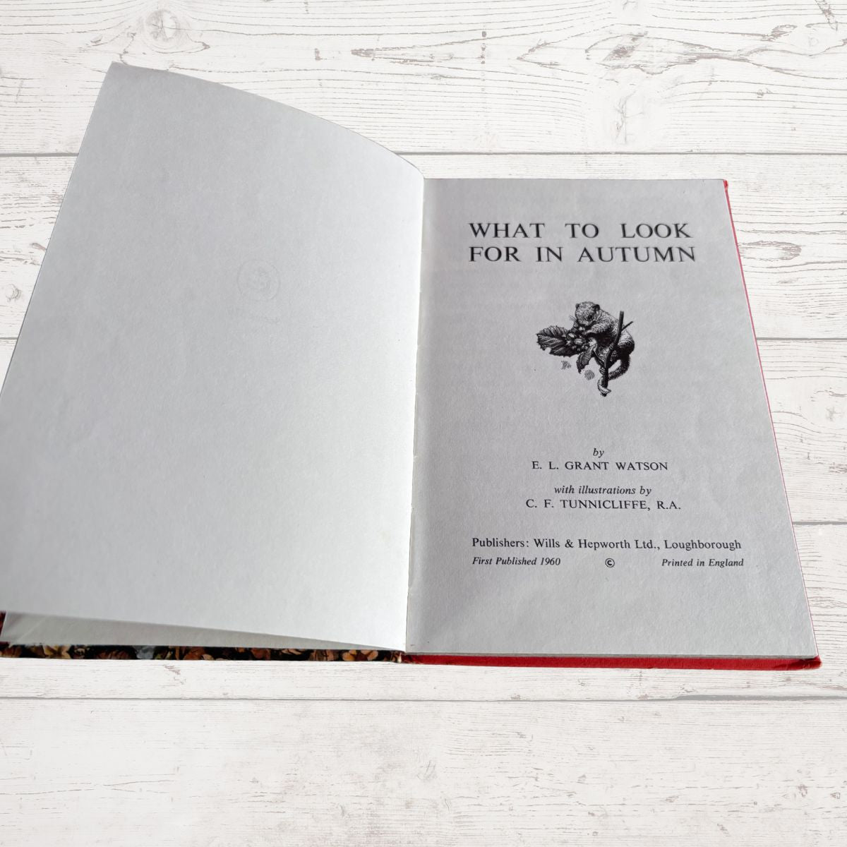 An open vintage book titled 'What to Look for in Autumn' 