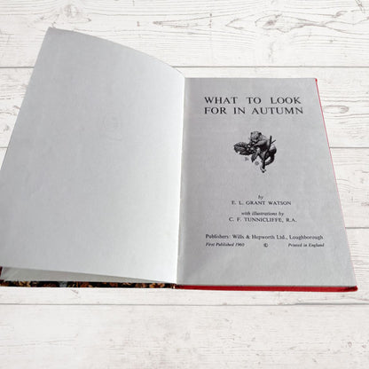 An open vintage book titled 'What to Look for in Autumn' 