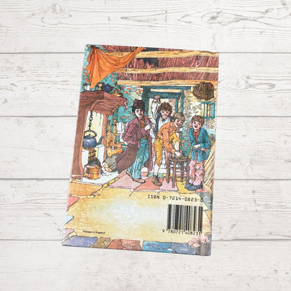 Book cover with illustration of three children in a room on a wooden surface