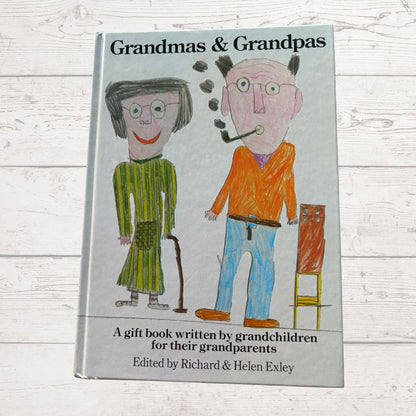 Book titled 'Grandmas & Grandpas' with illustrations of an elderly couple on a wooden surface.