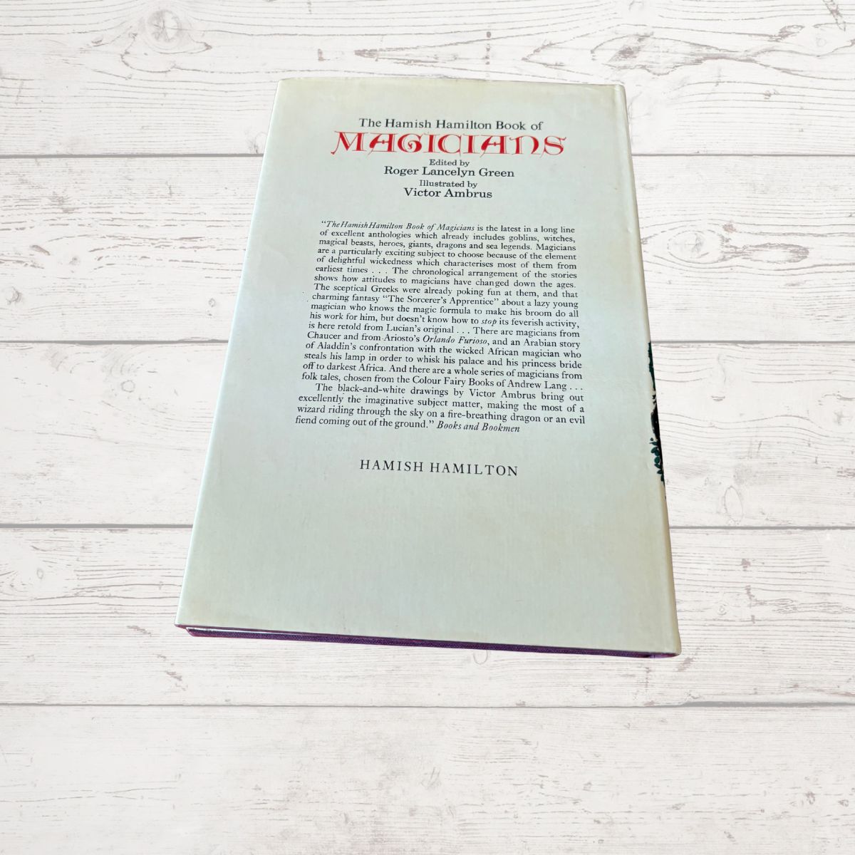 The back cover of the book 'The Hamish Hamilton Book of Magicians' by Roger Lonsdale Green, Volume 3, placed on a white wooden surface.