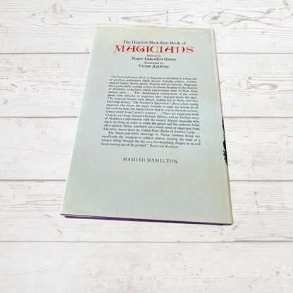 The back cover of the book 'The Hamish Hamilton Book of Magicians' by Roger Lonsdale Green, Volume 3, placed on a white wooden surface.