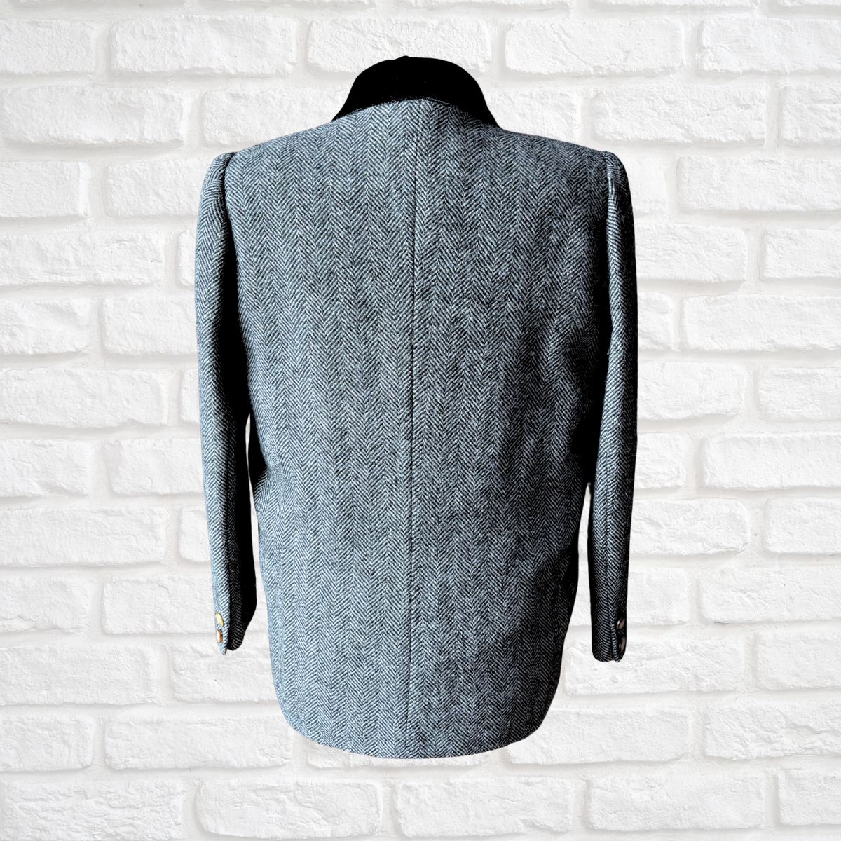 blazer on a white brick wall background