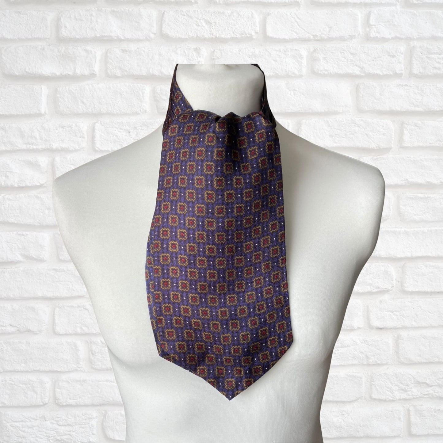 Mod style purple, gold, red and black tile print vintage cravat by British brand Duggie