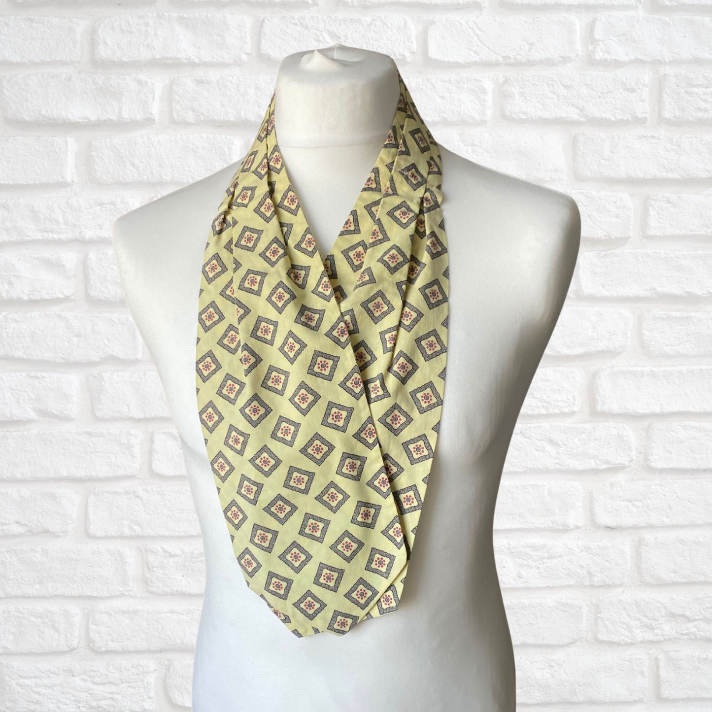 Mod style pale yellow, grey blue and red print vintage cravat by British brand Duggie