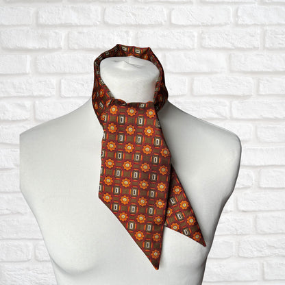 Unbranded vintage cravat - olive green with red, white and black geometric print and orange daisies 