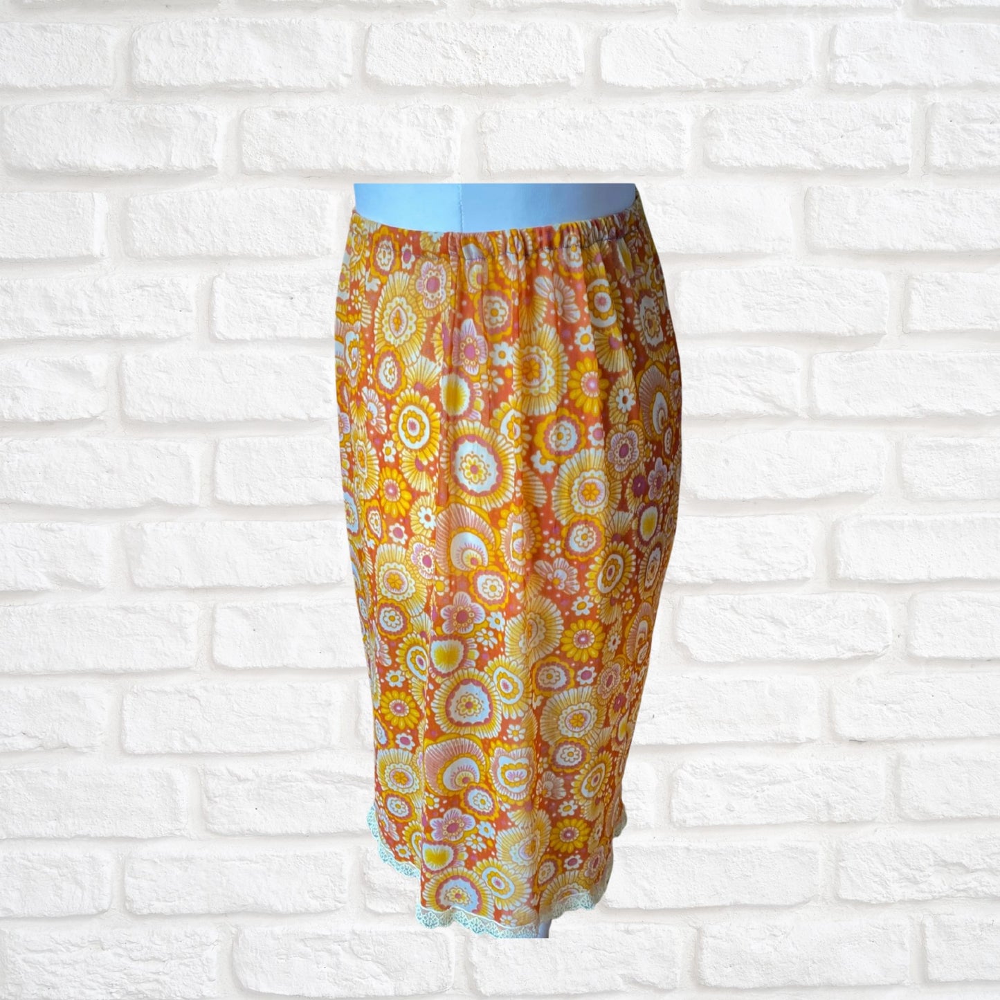 70s yellow and orange psychedelic print waist slip/ skirt. Approx U.K. size 14-20
