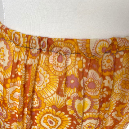 70s yellow and orange psychedelic print waist slip/ skirt. Approx U.K. size 14-20
