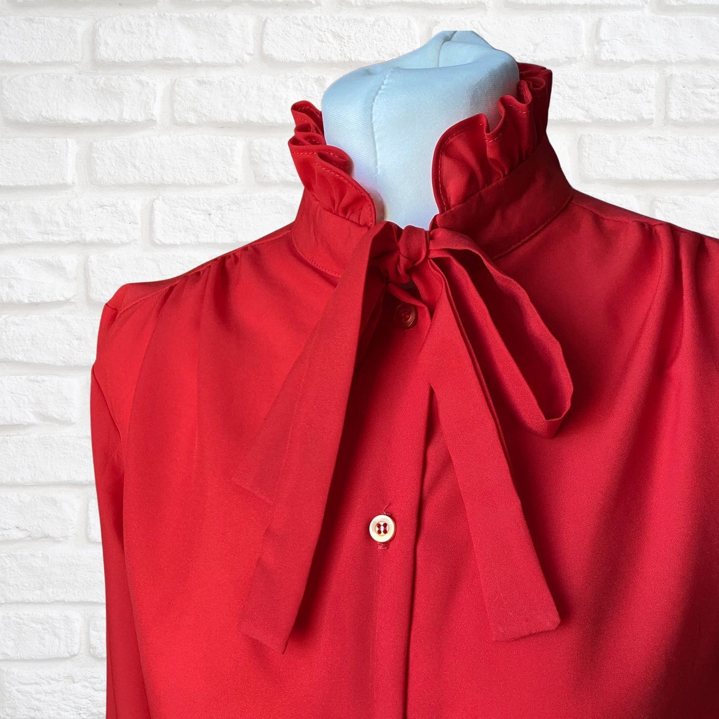 Red 80s secretary blouse with high frill collar and tie neck. Approx UK size 10-12