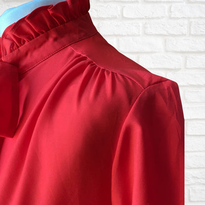 Red 80s secretary blouse with high frill collar and tie neck. Approx UK size 10-12