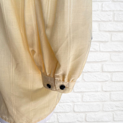 Yellow 80s blouse with black buttons and puffed short sleeves. Approx  U .K. size  14-18