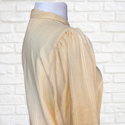 Yellow 80s blouse with black buttons and puffed short sleeves. Approx  U .K. size  14-18