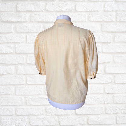 Yellow 80s blouse with black buttons and puffed short sleeves. Approx  U .K. size  14-18