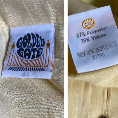 Yellow 80s blouse with black buttons and puffed short sleeves. Approx  U .K. size  14-18