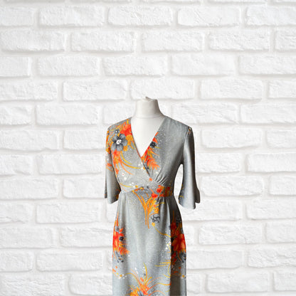 70s Hawaiian vintage maxi dress in an orange floral print.  Approx U.K. size 4-6