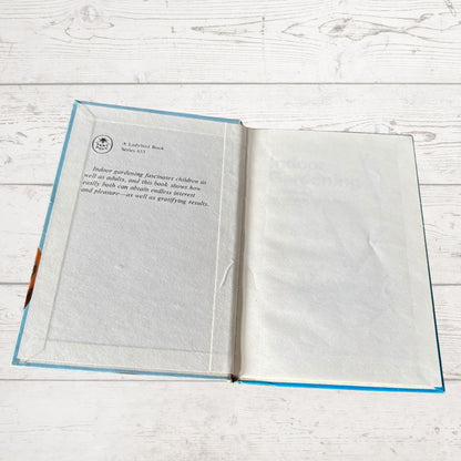 Open book on a wooden surface with text visible