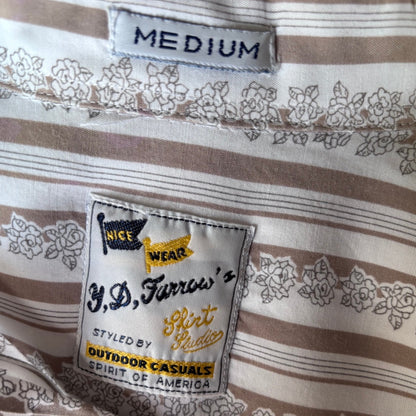 Close-up of the inside neck area of a striped short-sleeve shirt, showing a size label reading 'MEDIUM' and a sewn-in brand tag for 'JD Farrow
