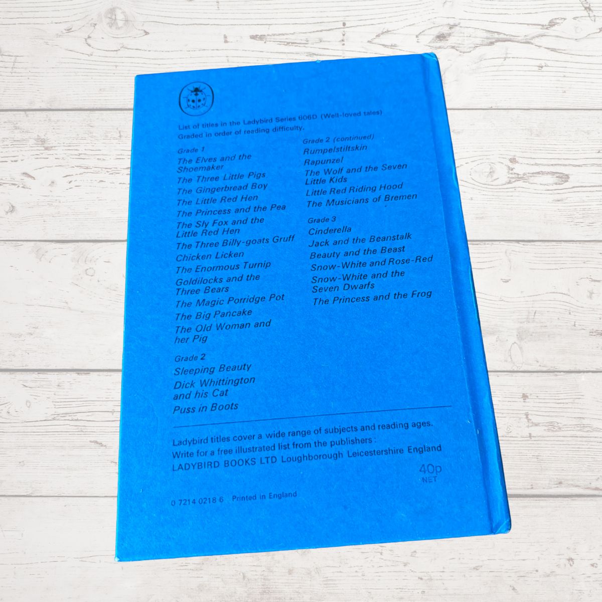 A bright blue children's book cover for 'Ladybird Books Little Myths' by Ladybird Books Ltd, photographed flat on a white wood background.
