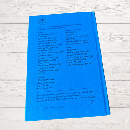 A bright blue children's book cover for 'Ladybird Books Little Myths' by Ladybird Books Ltd, photographed flat on a white wood background.