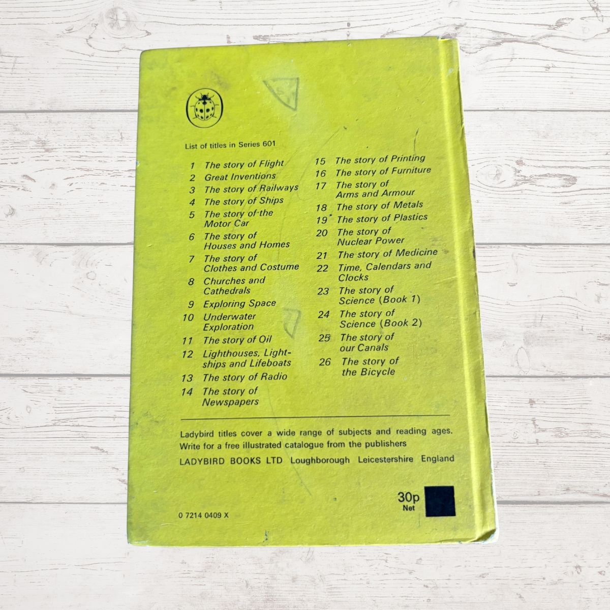 The back cover of a Ladybird Books children's book from Series 601, featuring a light green background with a printed tracklist of 30 stories and publisher details for Ladybird Books Ltd.